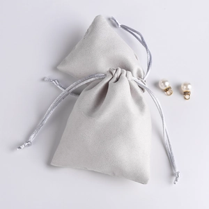 Soft light grey faux suede microfiber drawstring jewelry pouch with silver cords