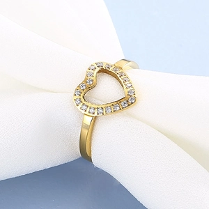 Elegant gold heart open ring with white zircons on soft white silk and blue background
