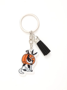 Close-up of Halloween cat pumpkin acrylic keychain with a black suede tassel charm