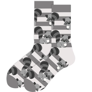 Close-up of crew socks featuring cute cartoon raccoon pattern and black and white stripes