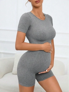 Detail of grey seamless ribbed knit maternity yoga set showing high stretch texture