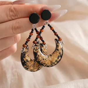 Vintage resin crescent earrings with gold leaf flakes and beaded drop design for women