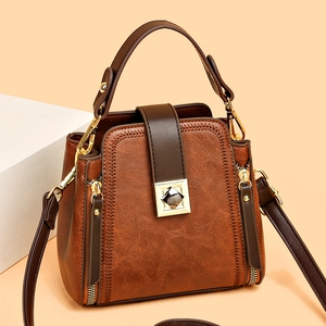 Vintage dark brown printed bucket bag with golden hardware and adjustable strap for women