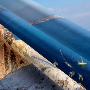 Macro detail of high-density tapestry fabric showing Santorini coastline digital print