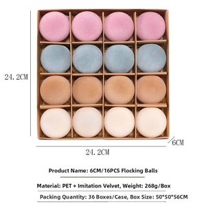 Close-up of 16-pack flocked velvet Christmas balls in a compartmentalized storage box