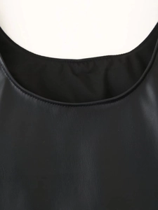 Close-up of matte black PU leather dress neckline featuring precision stitching detail