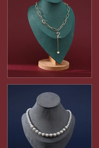 Detail of luxury pearl necklace and crystal letter Z pendant on a velvet display stand