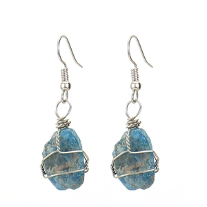 Detail of handmade silver wire wrapped raw blue apatite crystal bohemian drop earrings