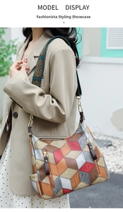 Detail view of colorful 3D geometric patchwork hobo bag with ethnic pattern wide strap