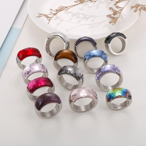 Detailed collection of wide titanium steel rings featuring large faceted colorful gemstones