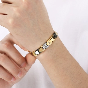 Bracelet magnétique bicolore en acier inoxydable avec maillons or, argent et noir pour homme