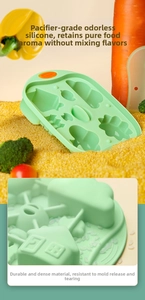 Detail of light green silicone food mold with cartoon shapes for baby meal prep