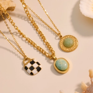 Layered gold stainless steel necklaces with turquoise pendant and checkered charm