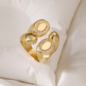 Adjustable 18K gold plated ring with sparkling oval pave cubic zirconia on white silk