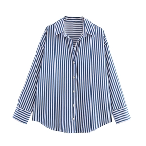 Detailed close-up of blue and white vertical striped poplin shirt with white buttons