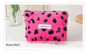 Detailed texture of rose red leopard print faux fur makeup bag with LOVE YOUTH label