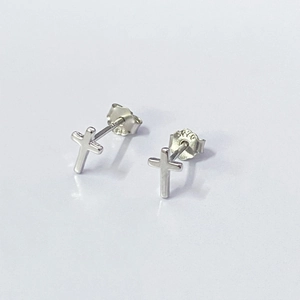 Close-up of S925 sterling silver cross stud earrings with hallmark detail
