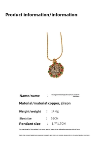 Detail view of gold-plated portrait necklace with red, green and white cubic zirconia