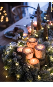 Set of five natural birch wood candle holders in varying heights for festive table decor