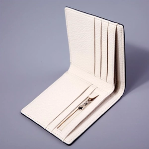 White leather bifold wallet with multiple card slots and a metal zipper coin pocket