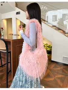 Detail showing plush texture and soft pink faux fur material of the large shoulder bag