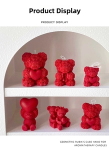 Detailed view of red rose textured bear scented candles in a minimalist display shelf