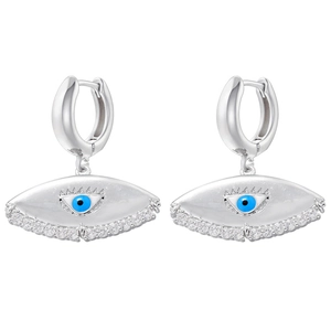 Macro shot of silver evil eye earrings with blue eye center and sparkling zircons