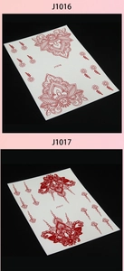 Macro view of red henna lace tattoo stickers J1016 and J1017 with mandala patterns