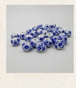 Detail of 12mm blue and white floral ceramic beads for DIY jewelry and handicraft