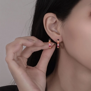 925 Sterling Silver colorful zircon hoop earrings with rainbow gradient stones shown on a model