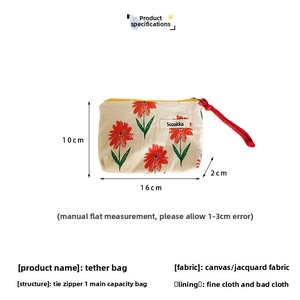 Vue détaillée de la trousse de maquillage à fleurs en toile, 16x10x2cm avec cordon