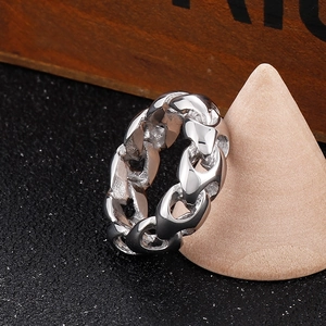 Minimalist silver stainless steel chain ring for men on a wooden display stand