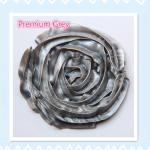 Macro detail of a premium silver grey rose-shaped resin charm for DIY craft decoration