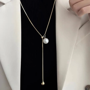 Elegant gold Y-shaped pearl sweater necklace for women with white pendant and snake chain