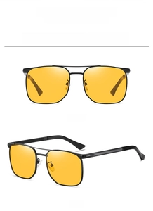 Close-up of black square frame sunglasses with yellow night vision lenses for men