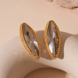 Detail of vintage marquise earrings with smoky grey crystal and golden beaded edge