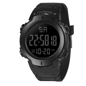 Close-up of black digital sports watch showing side buttons and large negative display