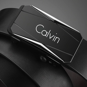 Close-up of black leather belt with automatic alloy buckle and engraved Calvin logo