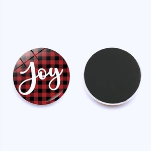 Detail of red buffalo plaid fridge magnet with white Joy script and magnetic back