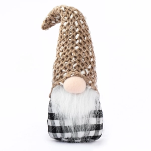 Christmas gnome doll with brown knitted hat and white beard on a white background