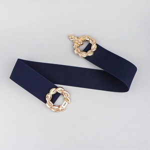 Detail of navy blue elastic corset belt with golden textured twist metal buckle closure
