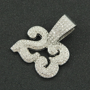 Close-up of hip hop silver fleur-de-lis pendant with micro-pave clear cubic zirconia
