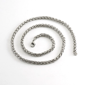 Detail of silver stainless steel keel chain showing retro punk weave texture