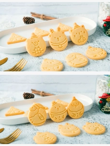 Christmas cookies in shapes of Santa, reindeer, and trees with detailed embossed patterns