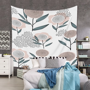 Detail of bohemian tapestry featuring abstract floral patterns in a modern bedroom