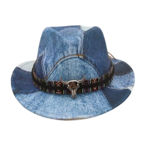 Detail of vintage patchwork denim fedora with woven band and silver bull skull ornament