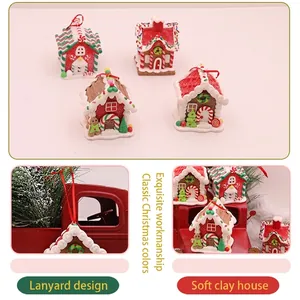 Set of four handmade polymer clay gingerbread house ornaments with red hanging ribbons