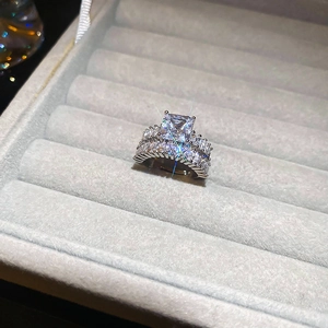 Detail of square zircon ring set with micro-paved band in luxury velvet jewelry box
