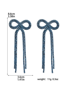 Detail showing blue crystal bow earrings size 8.6cm length and weight 11g specifications