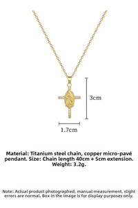 Detailed view of gold cross pendant with cubic zirconia and stainless steel chain